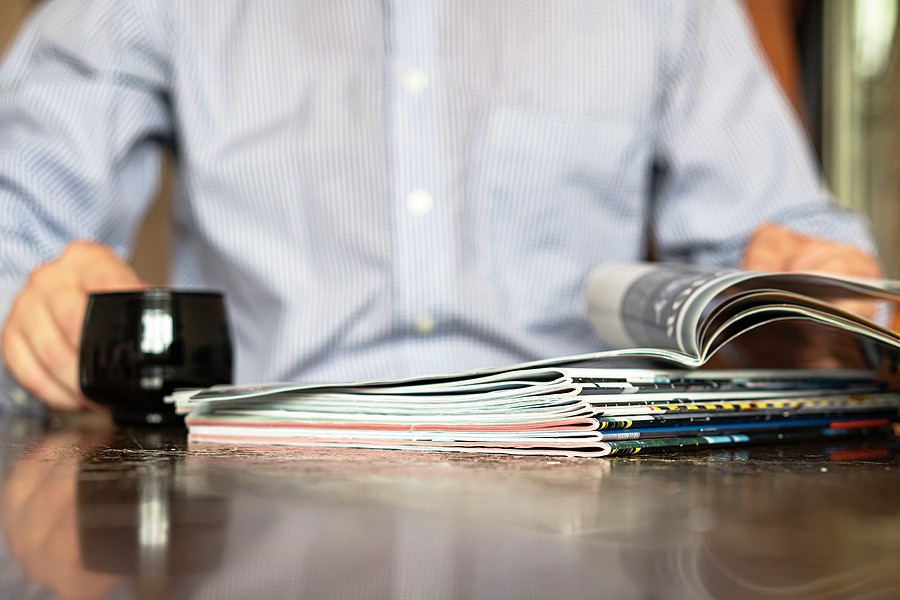 In The Foreground Are Magazines, In The Background In Defocus La